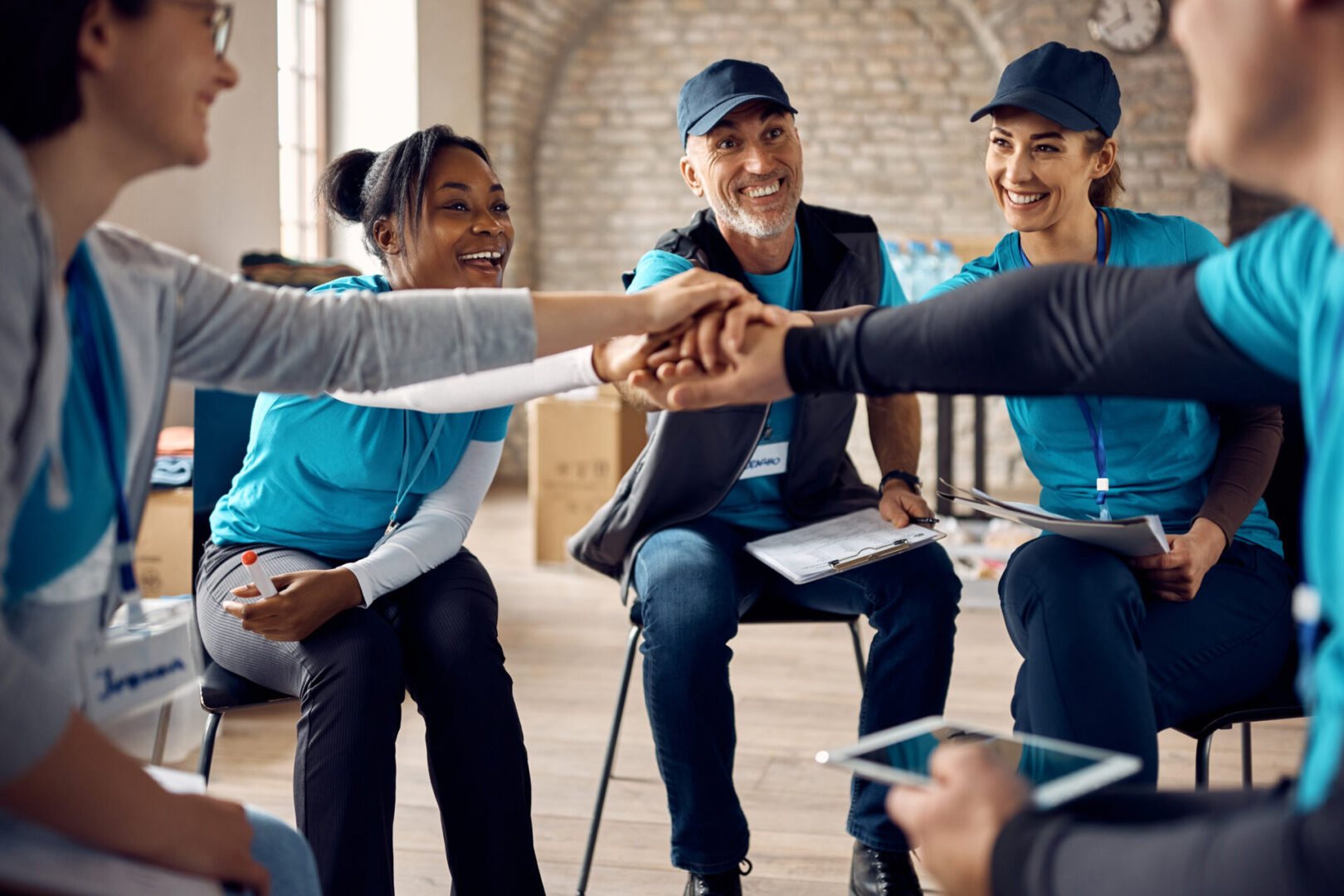 A group of people holding hands in a circle.