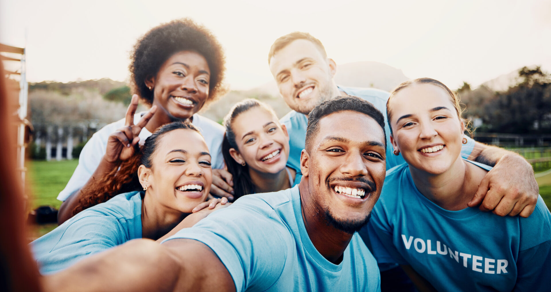 A group of people taking a selfie together.