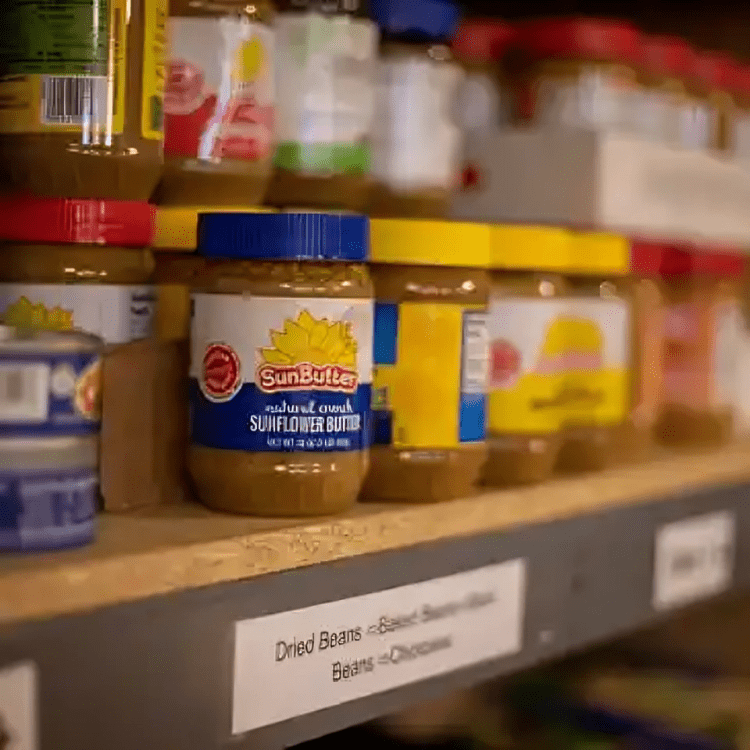 A shelf with many different types of food on it.